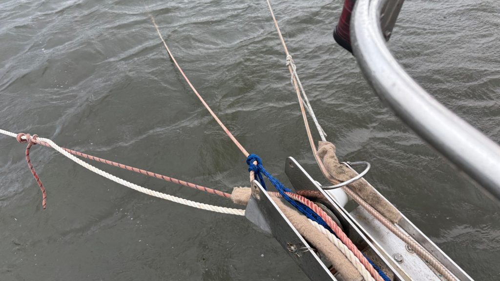 Three anchor lines set off the bow of Grit