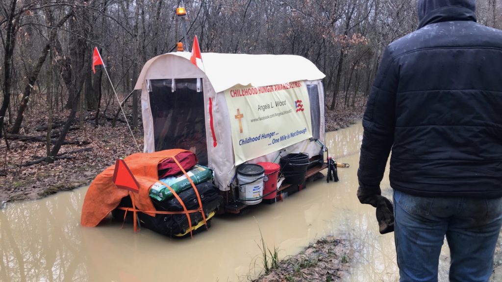 Angela Wood's covered wagon sunk deep in Arkansas mud